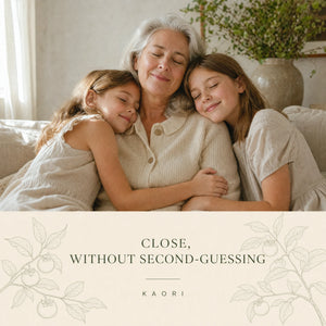 A grandmother embracing her two grandchildren
